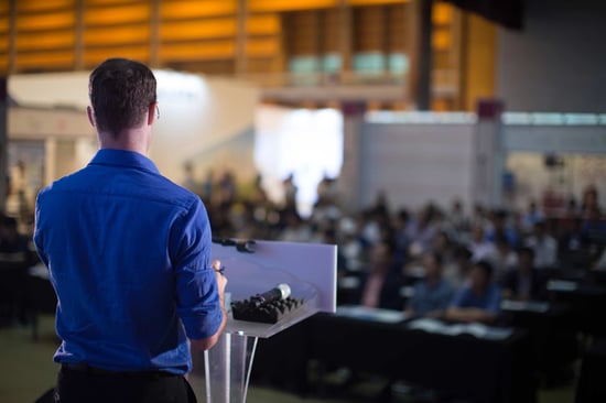 speaker presenting in front of audience